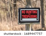 No Hunting Or Trespassing Sign...
