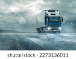 
truck on wet road in heavy rain under cloudy sky