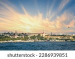 Small photo of View of Istanbul Selimiye Barracks, Bosphorus and Istanbul cityscape. Selimiye Barracks is a historical structure. Panoramic shot, blue sky background.