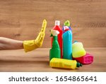 Small photo of Renouncement from cleaning products. Cleaning products over wood background