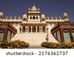 Small photo of A guard is passing in front ofJaswant Thada. This is a splendid marble cenotaph monument and also a mausoleum for the kings of Marwar. The memorial was built in 1899. Jodphur India February 2015