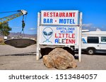 Small photo of Rachel, Nevada / USA: Circa September 2019 The iconic wrecker hauling what appears to be a flying saucer. This wrecker is part of the Little A'Le'Inn parking lot. The signs reads "Earthlings Welcome"