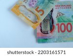 Small photo of 18 September 2022; Kuala Lumpur Malaysia. New Zealand banknotes on white background. The New Zealand dollar is the official currency and legal tender of New Zealand.