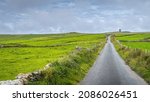 Small photo of Country road leading to Moher Tower at Hags Head in Cliffs of Moher, popular tourist attraction, Wild Atlantic Way, County Clare, Ireland