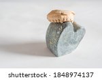 Small photo of A closeup shot of heart-shaped stone with teeth molder against a white background