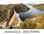Small photo of An aerial view of the Embalse de Barcena, a gravity dam in the El Bierzo region with a hydroelectric power station in Ponferrada, Spain