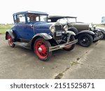 Small photo of MORON, ARGENTINA - Mar 27, 2022: Old blue Ford Model A coupe hardtop with rumble seat circa 1930 parked at an airstrip Front view CADEAA MNA 2022 classic car show