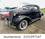 Small photo of MORON, ARGENTINA - Mar 27, 2022: Moron, Argentina - Mar 26, 2022 - old black Chevrolet Chevy Master coupe with rumble seat 1938 by GM CADEAA 2021 classic car show