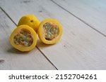 Small photo of The yellow flavicarpa variety of Passiflora edulis, a vine species of passion flower, is cultivated commercially for its sweet, seedy fruit