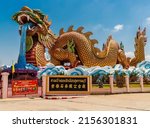 Small photo of SUPHANBURI, THAILAND - Apr 20, 2022: The dragon temple in Suphanburi, Thailand - amazing Chinese temple artwork at this temple