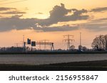 A Scenic View Of Powerlines In...