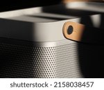 Small photo of MUNICH, GERMANY - Mar 16, 2022: A macro view of the details of a silver Bang Olufsen Beolit 17 bluetooth speaker