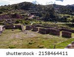 Small photo of A beautiful view of the Puka Pukara Inca Archaeological Complex with its stone walls in Cusco, Peru