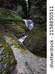 Small photo of A vertical shot of a waterfall at Watkins Glen State Park, Finger Lake region, upstate New York, USA