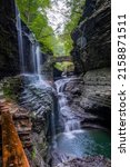 Small photo of A vertical shot of the Rainbow Falls at Watkins Glen State Park, Finger Lakes, upstate New York, USA