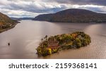 Small photo of An aerial shot of the Bannerman's Castle on the Hudson River surrounded by hills in Dutchess County, New York