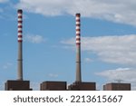 Small photo of SINES, PORTUGAL - May 04, 2022: A view over Sines thermoelectric power station with blue sky in the background