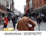 Small photo of DUBLIN, IRELAND - May 19, 2022: A Busker performing on Grafton street Dublin