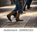 Small photo of A closeup shot of the legs of traditional western folk dancing under the music
