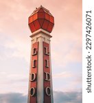 Small photo of MARGATE, GB - Jun 06, 2021: A vertical shot of the Lido Tower at Cliftonville with a pink cloudy sky in the background, Margate, United Kingdom