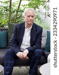 Small photo of KOL, DE - Aug 21, 2022: A vertical shot of Richard Dawkins at a conference on Dissent in Koln, Germany, looking at the camera