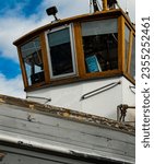 Small photo of FAVERSHA, GB - Jul 09, 2022: A closeup of detail of wheelhouse aboard veteran vessel undergoing work in the Faversham Boatyard