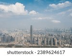 An aerial view of a bustling city skyline with modern buildings in Wuhan, China