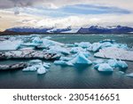 Big pieces of ice (floe) from glacier in the lake, ice islands, glacier and mountains, Jökulsárlón - Glacier Lagoon