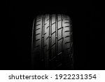 Small photo of KRASNOYARSK, Russia February 22, 2021: New tires Bridgestone potenza adrenalin RE 004. front view on a black background