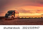 Camper van at sunset on beach