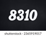 Small photo of Black for the background. The number 8310 is made of white painted wood.