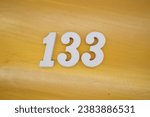 Small photo of The golden yellow painted wood panel for the background, number 133, is made from white painted wood.