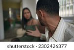 Small photo of Couple_s relationship troubles escalate into heated argument. Young man and woman yelling during verbal altercation. Emotional crisis between partners. Anger and frustration in romantic relationship