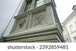 Small photo of Traditional adornment on European building symbolizing the medieval trickster archetype