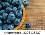 Small photo of blueberries in a wooden bowl Blueberries. These violet-hued gems are rich in anthocyanins, potent antioxidants that bolster collagen structure in the retina and provide extra vision protection