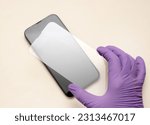 Small photo of glass film change,repair and maintenance smartphone.hand in glove holding screen protection.flying in air tempered glass and phone.medical stethoscope meaning mobile doctor.tools and display napkin