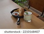 Small photo of A sandwich is a food typically consisting of vegetables, sliced cheese or meat, placed on or between slices of bread, or more generally any dish wherein bread serves as a container or wrapper for anot