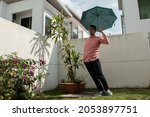 Small photo of Sunday, November 11, 2018. A man with red checkered shirt dancing with his Vans Era 95 Reissue 50th Anniversary edition sneakers, in a residential area at Cyberjaya city, Selangor, Malaysia.