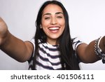 Close-up of young beautiful woman taking selfie. Isolated white background