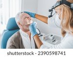 Doctor checking man throat with medical stick. Vocal cords medical health checkup in clinic. Glands swollen. Otorhinolaryngologist visit