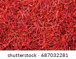 Small photo of surface of saffron threads, autumn crocus, full frame, saffron background