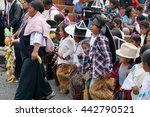 Small photo of COTACACHI, ECUADOR - JUNE 23, 2016: Children's parade in Inti Raymi, the Quechua solstice celebration. Fruit and food offerings are brought forward for Mother Earth.