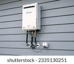 Small photo of External continuous flow gas water heater, Rinnai A26 26L Heater. Auckland, New Zealand - July 18, 2023