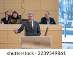 Small photo of Kiel, Germany, December 16th, 2022 Plenary session in the Landeshaus Kiel the member of the FDP Dr. Bernd Buchholz during his speech in front of the plenum