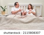Small photo of Ascertaining the paternity of a child between mother and father. Man and woman and with newborn baby in the bedroom