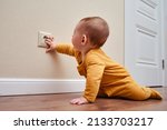 Baby toddler reaches into the...