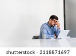 Small photo of Businessman office working holding sore head pain from desk working and sitting all day using laptop computer or notebook suffering headache sick worker overworking concept