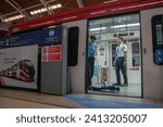 Small photo of JAKARTA, INDONESIA-JANUARY 2024- Train officers inspect carriages in the Jabodebek LRT train series at Dukuh Atas LRT station on 16, January 2024 in Jakarta.