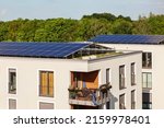 Small photo of Solar Panels on House Roof. Solar Home. High-rise Buildings with Solar Panels on Roof