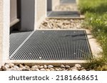 Small photo of French drain, Gutter drain grate, Drain Grid in Front of Door. Floor drains - sewer cover. Stainless Grate of water Drain in front of Entrance Door.